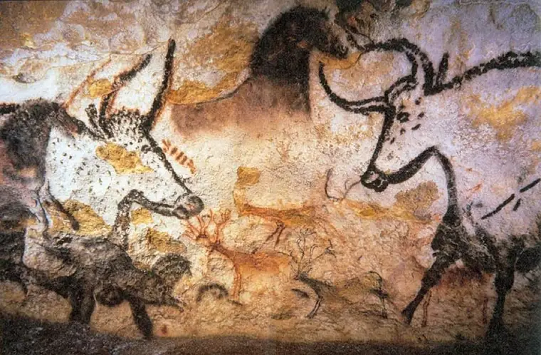 Prehistoric cave painting from Lascaux, showing animals in ochre and black pigment